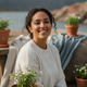 Portrait of a smiling woman in her late 20s, looking content and refreshed after an outdoor activity.